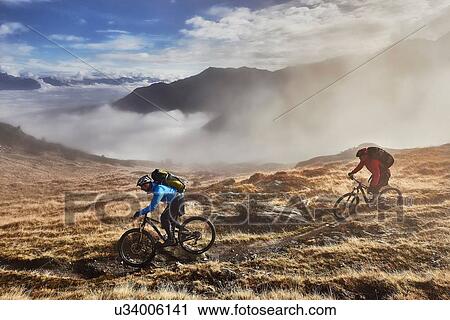 "Mature men mountain biking, Valais, Switzerland" View Large Photo Image Stock Image - "Mature men mountain biking, Valais, Switzerland". Fotosearch