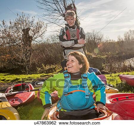 "Mature woman in kayak, smiling" View Large Photo Image Stock Image - "Mature woman in kayak, smiling". Fotosearch