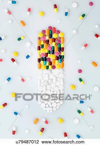 Medical pills and tablets in shape of drug capsule and scattered View Large Photo Image Stock Image - Medical pills and tablets in shape of drug capsule and scattered. Fotosearch