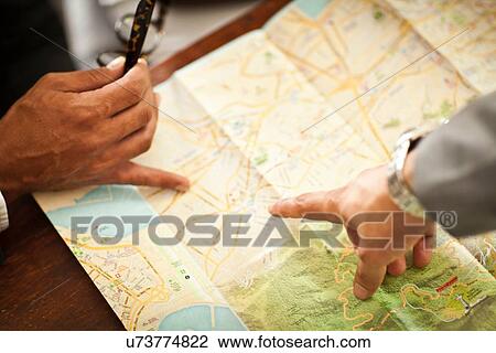 "Men map-reading, view of hands" View Large Photo Image Stock Image - "Men map-reading, view of hands". Fotosearch