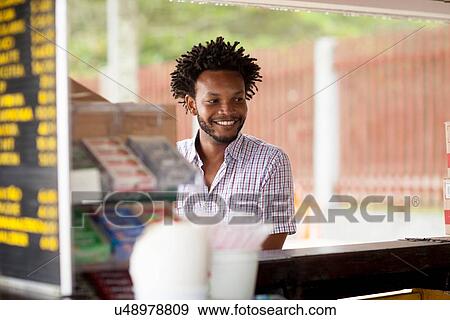 "Mid adult man at beach bar, Ipanema beach, Rio De Janeiro, Brazil" View Large Photo Image Stock Photo - "Mid adult man at beach bar, Ipanema beach, Rio De Janeiro, Brazil". Fotosearch