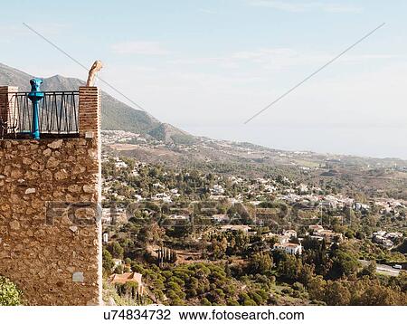 "Mid adult woman standing on balcony, looking at view, Mijas, Andalucia, Spain" View Large Photo Image Stock Image - "Mid adult woman standing on balcony, looking at view, Mijas, Andalucia, Spain". Fotosearch