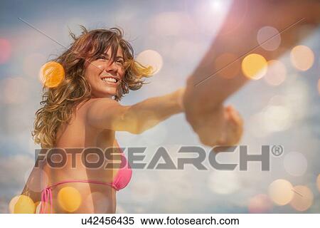 Mid adult woman wearing bikini top View Large Photo Image Stock Photography - Mid adult woman wearing bikini top. Fotosearch