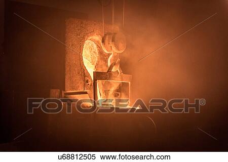 Stock Photography - Molten metal being poured in foundry. Fotosearch