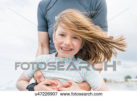 Mother and daughter by the seaside View Large Photo Image Stock Photo - Mother and daughter by the seaside. Fotosearch