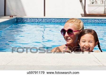 Mother and daughter in pool together View Large Photo Image Stock Photo - Mother and daughter in pool together. Fotosearch