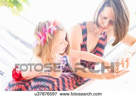 Stock Photo - Mother and daughter playing together. Fotosearch