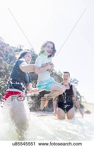 "Mother and daughter, with friend, by the seaside" View Large Photo Image Stock Image - "Mother and daughter, with friend, by the seaside". Fotosearch