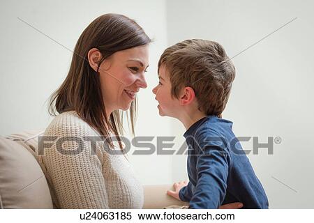 "Mother and son smiling at each other, face to face" View Large Photo Image Stock Photography - "Mother and son smiling at each other, face to face". Fotosearch