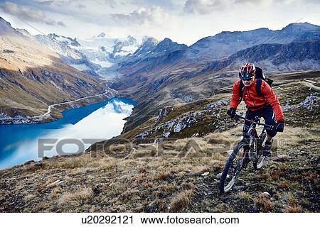 Stock Image - "Mountain biker, Valais, Switzerland". Fotosearch