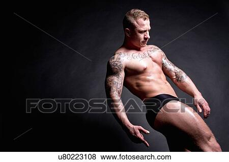 Muscular young man leaning back View Large Photo Image Stock Photo - Muscular young man leaning back. Fotosearch