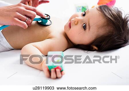 Paediatrician checking baby boy's heart using stethoscope View Large Photo Image Stock Image - Paediatrician checking baby boy's heart using stethoscope. Fotosearch