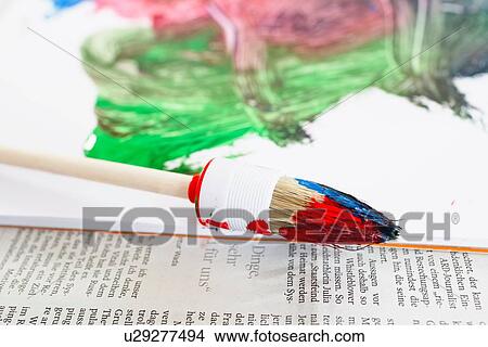 "Paint brush, painted paper and newspaper" View Large Photo Image Picture - "Paint brush, painted paper and newspaper". Fotosearch