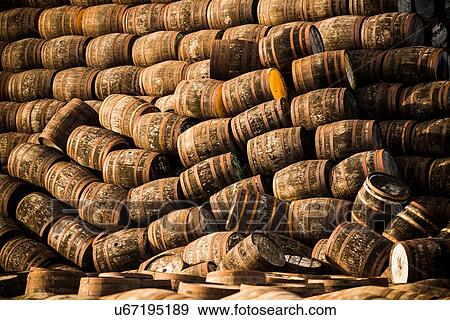 Stock Photo - Pile of wooden whisky casks. Fotosearch