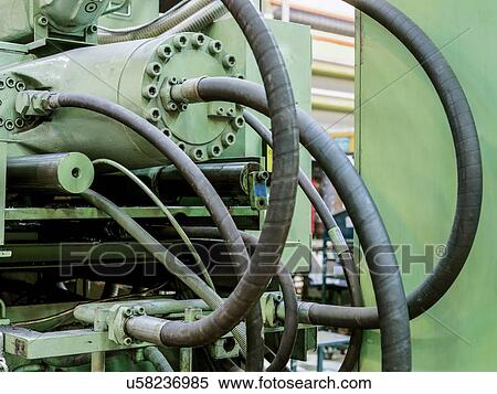 Stock Photography - "Plastic injection moulding machine in factory, close up". Fotosearch