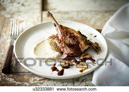 "Plate with lamb chop, gravy and mashed potato" View Large Photo Image Stock Image - "Plate with lamb chop, gravy and mashed potato". Fotosearch