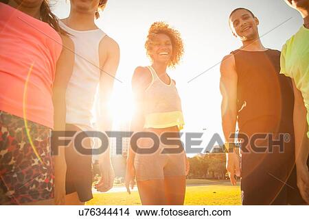 Picture - Portrait of adult friends training in park. Fotosearch