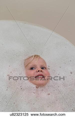Portrait of angelic female toddlers face in bubble bath View Large Photo Image Stock Photography - Portrait of angelic female toddlers face in bubble bath. Fotosearch