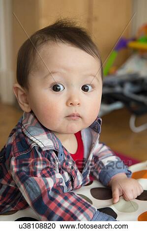 Stock Image - "Portrait of baby boy, looking at camera". Fotosearch