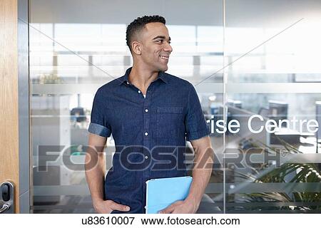 Portrait of businessman at office door View Large Photo Image Stock Photo - Portrait of businessman at office door. Fotosearch