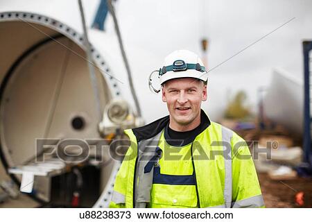 Portrait of engineer at wind farm View Large Photo Image Stock Image - Portrait of engineer at wind farm. Fotosearch