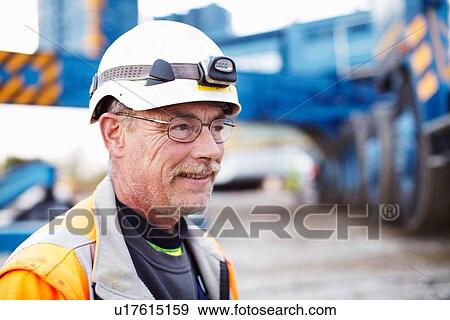 Portrait of engineer at wind farm View Large Photo Image Stock Photo - Portrait of engineer at wind farm. Fotosearch