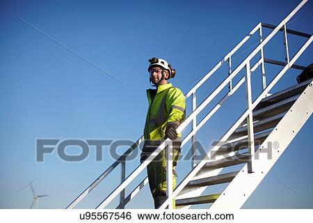 "Portrait of engineer on steps, at wind farm" View Large Photo Image Stock Photograph - "Portrait of engineer on steps, at wind farm". Fotosearch