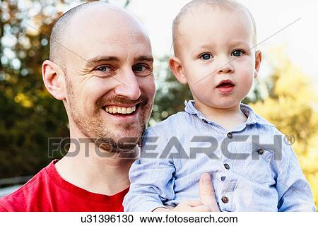 Stock Image - Portrait of father and son. Fotosearch