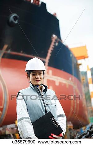 "Portrait of female worker at shipyard, GoSeong-gun, South Korea" View Large Photo Image Stock Image - "Portrait of female worker at shipyard, GoSeong-gun, South Korea". Fotosearch