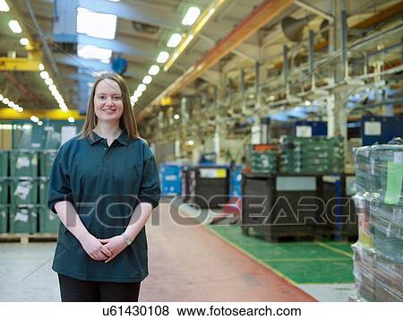 "Portrait of female worker in factory, smiling" View Large Photo Image Stock Photo - "Portrait of female worker in factory, smiling". Fotosearch