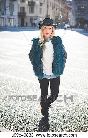 Portrait of funky young woman in town square View Large Photo Image Stock Image - Portrait of funky young woman in town square. Fotosearch