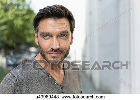 Portrait of handsome mature man on city street View Large Photo Image Stock Photo - Portrait of handsome mature man on city street. Fotosearch