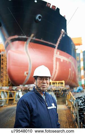 Stock Image - "Portrait of male worker at shipyard, GoSeong-gun, South Korea". Fotosearch