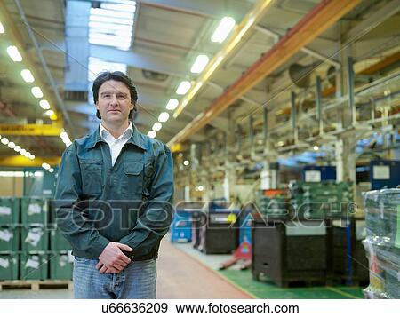 Stock Photo - "Portrait of male worker in factory, smiling". Fotosearch