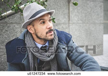 Portrait of mid adult businessman sitting on stairway View Large Photo Image Picture - Portrait of mid adult businessman sitting on stairway. Fotosearch