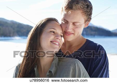 "Portrait of romantic young couple at lakeside, German Alps, Germany" View Large Photo Image Stock Photograph - "Portrait of romantic young couple at lakeside, German Alps, Germany". Fotosearch