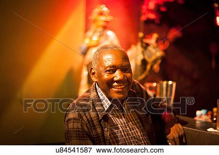 "Portrait of senior man at cocktail bar, Rio De Janeiro, Brazil" View Large Photo Image Stock Photo - "Portrait of senior man at cocktail bar, Rio De Janeiro, Brazil". Fotosearch