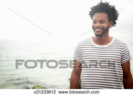 "Portrait of smiling mid adult man on Ipanema beach, Rio De Janeiro, Brazil" View Large Photo Image Stock Image - "Portrait of smiling mid adult man on Ipanema beach, Rio De Janeiro, Brazil". Fotosearch