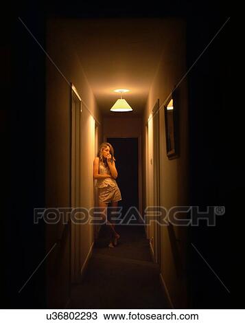 Portrait of teenage girl alone in dark corridor View Large Photo Image Stock Image - Portrait of teenage girl alone in dark corridor. Fotosearch