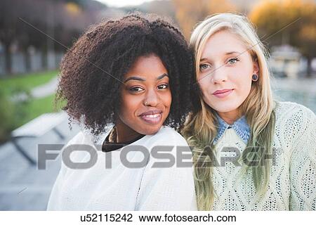 "Portrait of two young stylish female friends in lakeside park, Como, Italy" View Large Photo Image Stock Image - "Portrait of two young stylish female friends in lakeside park, Como, Italy". Fotosearch
