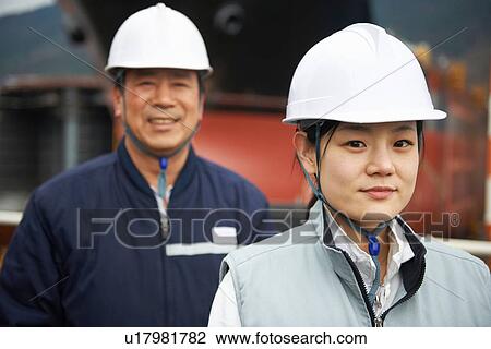 Stock Image - "Portrait of workers at shipyard, GoSeong-gun, South Korea". Fotosearch