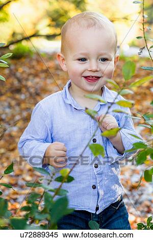 Portrait of young boy in rural setting View Large Photo Image Stock Photography - Portrait of young boy in rural setting. Fotosearch