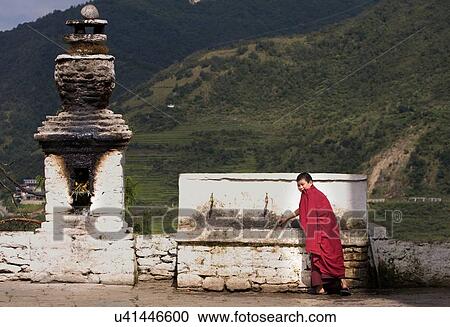 "Portrait of young buddhist monk drinking at temple fountain, Punakha, Bhutan" View Large Photo Image Stock Image - "Portrait of young buddhist monk drinking at temple fountain, Punakha, Bhutan". Fotosearch