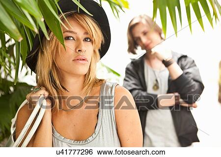 Stock Photograph - "Portrait of young couple outside hotel, Rio De Janeiro, Brazil". Fotosearch