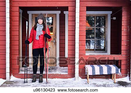 "Portrait of young female skier on cabin porch, Posio, Lapland, Finland" View Large Photo Image Stock Image - "Portrait of young female skier on cabin porch, Posio, Lapland, Finland". Fotosearch