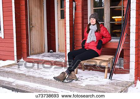 "Portrait of young female skier sitting in cabin porch, Posio, Lapland, Finland" View Large Photo Image Stock Image - "Portrait of young female skier sitting in cabin porch, Posio, Lapland, Finland". Fotosearch