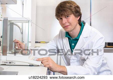 Portrait of young male pharmacist experimenting in pharmacy laboratory View Large Photo Image Stock Image - Portrait of young male pharmacist experimenting in pharmacy laboratory. Fotosearch