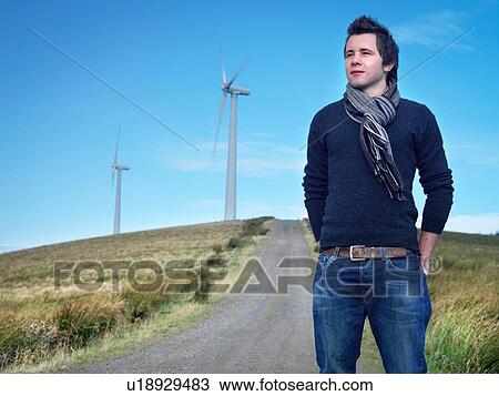 Portrait of young man at windfarm View Large Photo Image Stock Image - Portrait of young man at windfarm. Fotosearch