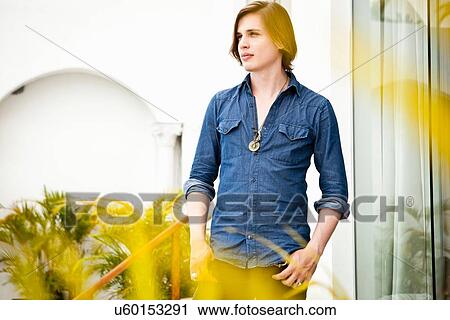 Portrait of young man outside hotel View Large Photo Image Stock Image - Portrait of young man outside hotel. Fotosearch