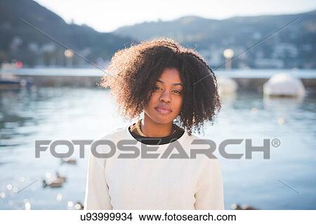 Picture - "Portrait of young woman at Lake Como, Italy". Fotosearch